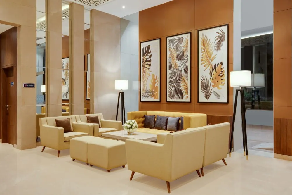 Lounge Seating Area with Artwork — Hotel Aketa Dehradun