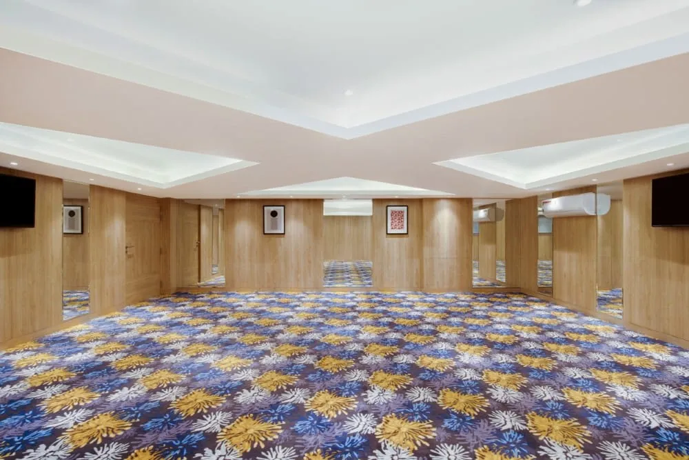 Chamber Hall Board Room Setup with Floral Carpet — Hotel Aketa Dehradun