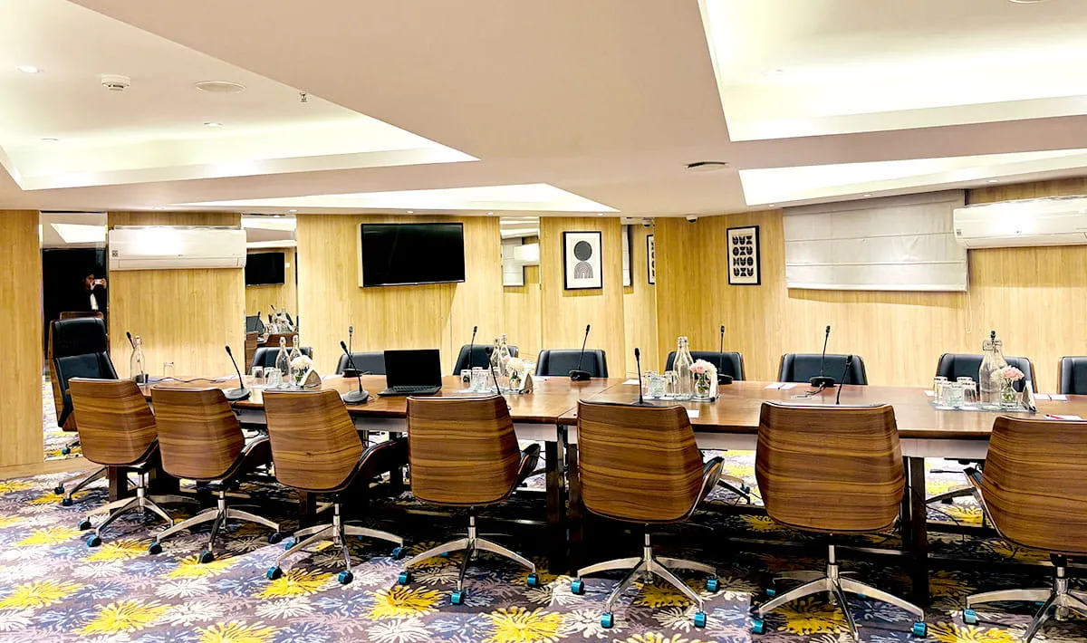 Chambers Board Room with Oval Table Seating for Executive Meetings — Hotel Aketa Dehradun