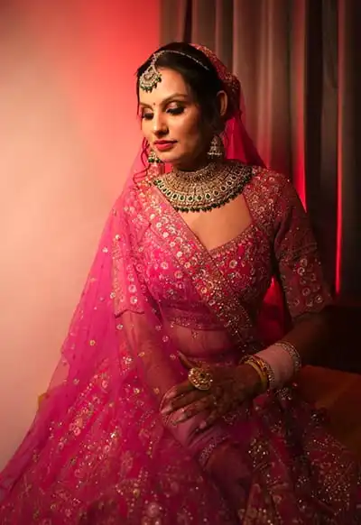 Bridal Portrait in Pink Lehenga with Gold Jewellery — Hotel Aketa Dehradun