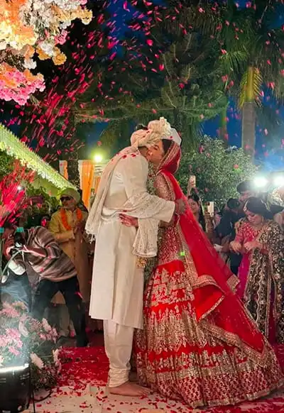 Wedding Couple Under Floral Shower at Outdoor Night Ceremony — Hotel Aketa Dehradun